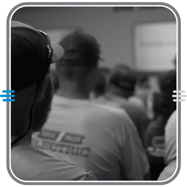Framed image of a team member observing a safety meeting.