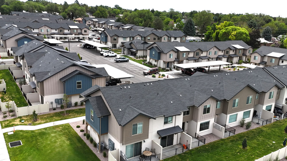 New build electrical installation at a townhouse development in Idaho by Magic Valley Electric Express services. Exterior view of multiple unit building